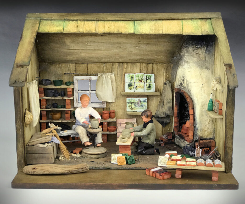 dollhouse display in warsaw tiny figureens dolls cross section view inside house coal fireplace oven ceramic wheel figures clay workers craftsmen unique museums in warsaw's old town